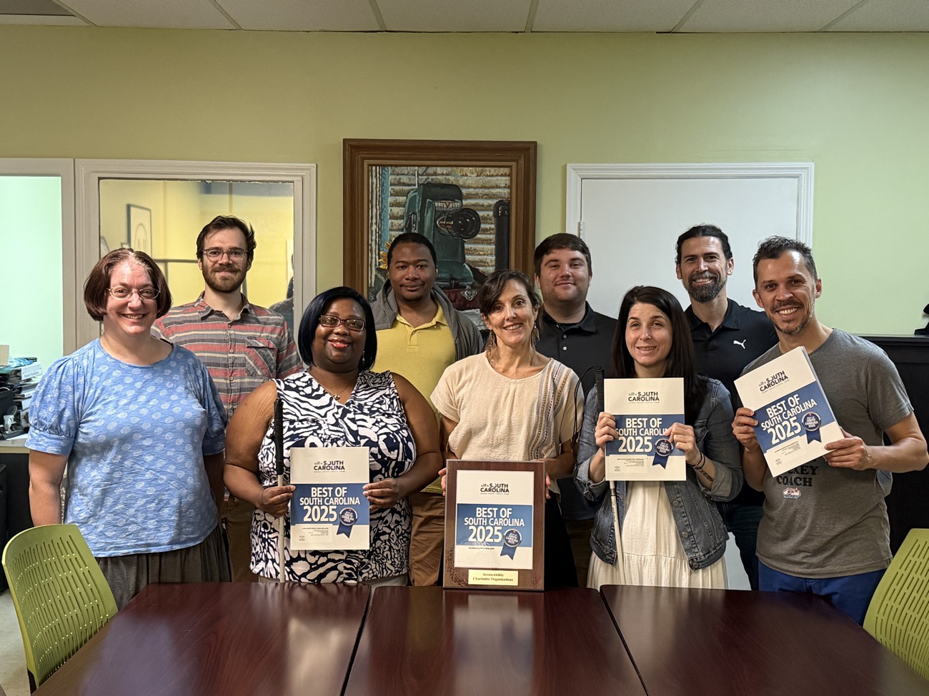 The AccessAbility team holding awards recognizing their work across South Carolina.